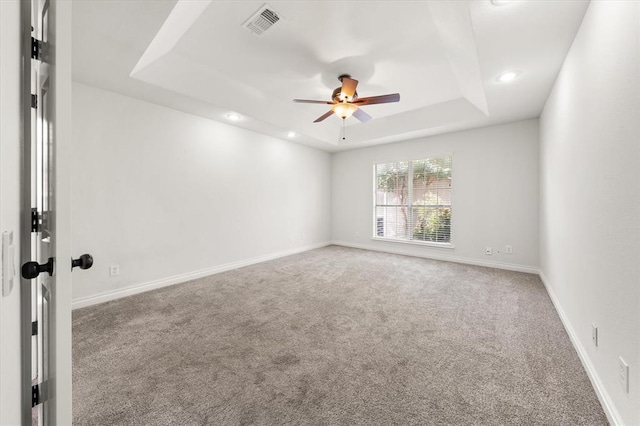541 SW 154th Ct, Oklahoma City, OK 73170 - spare room with carpet, ceiling fan, a raised ceiling, and recessed lighting