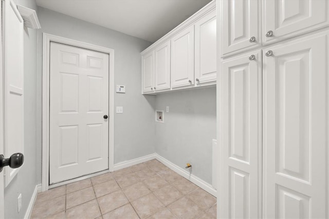 541 SW 154th Ct, Oklahoma City, OK 73170 - laundry area with cabinet space, washer hookup, and light tile patterned floors