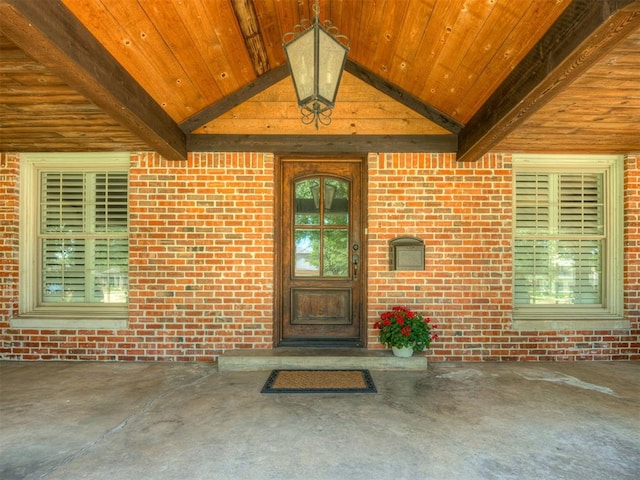 1718 Guilford Ln, Oklahoma City, OK 73120 - doorway to property featuring brick siding