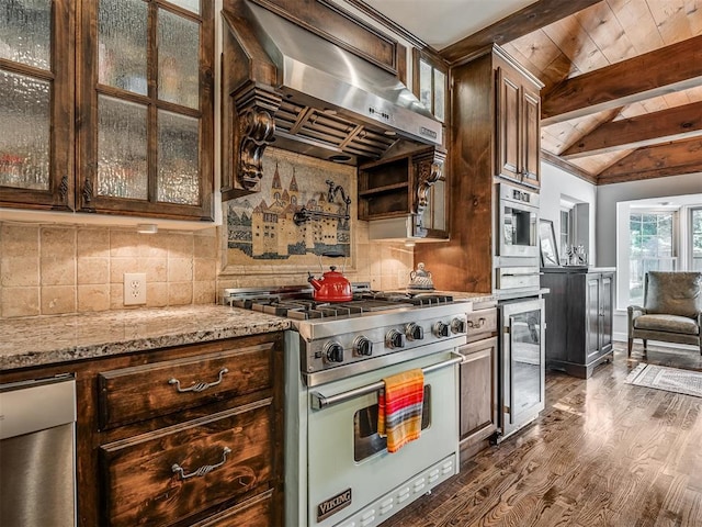 1718 Guilford Ln, Oklahoma City, OK 73120 - kitchen with premium stove, beverage cooler, ventilation hood, dark brown cabinets, and dark wood-style floors