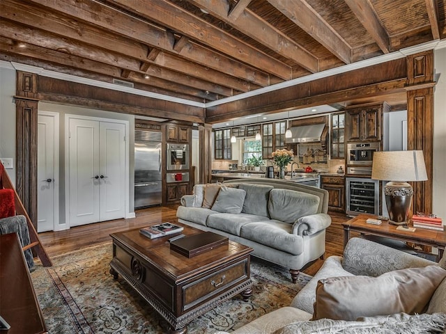 1718 Guilford Ln, Oklahoma City, OK 73120 - living room with wine cooler and dark wood-style floors