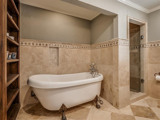 1718 Guilford Ln, Oklahoma City, OK 73120 - full bathroom featuring tile walls, ornamental molding, a freestanding tub, tiled shower, and a wainscoted wall