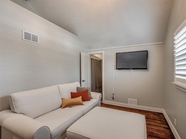 1718 Guilford Ln, Oklahoma City, OK 73120 - living area with vaulted ceiling, wood finished floors, and plenty of natural light