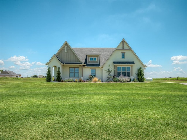 7290 NE Hawk Dr, Piedmont, OK 73078 - view of front of home with a front yard and a shingled roof