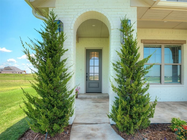 7290 NE Hawk Dr, Piedmont, OK 73078 - entrance to property featuring a yard and brick siding