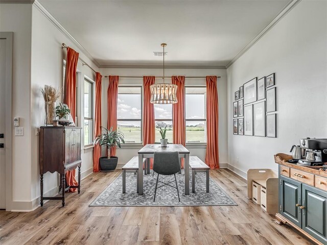 7290 NE Hawk Dr, Piedmont, OK 73078 - dining space with ornamental molding, a chandelier, and light wood-type flooring