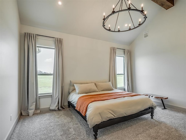 7290 NE Hawk Dr, Piedmont, OK 73078 - carpeted bedroom with a chandelier, beamed ceiling, and high vaulted ceiling
