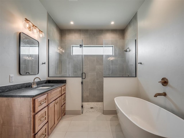 7290 NE Hawk Dr, Piedmont, OK 73078 - bathroom featuring a shower stall, a freestanding tub, vanity, and recessed lighting