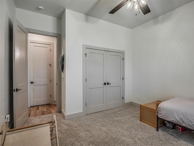 7290 NE Hawk Dr, Piedmont, OK 73078 - bedroom with light colored carpet, a closet, and ceiling fan