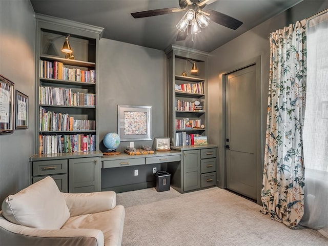 7290 NE Hawk Dr, Piedmont, OK 73078 - sitting room with ceiling fan, carpet, built in desk, and built in shelves