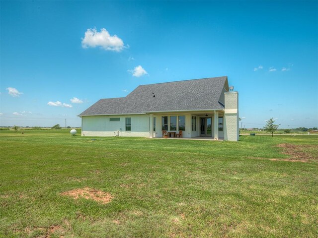 7290 NE Hawk Dr, Piedmont, OK 73078 - back of property featuring a patio area and a yard