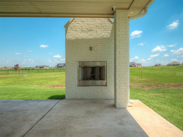 7290 NE Hawk Dr, Piedmont, OK 73078 - view of patio / terrace with an outdoor brick fireplace