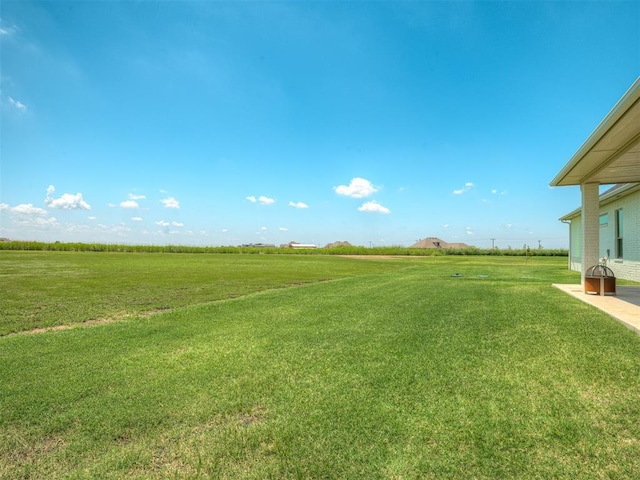 7290 NE Hawk Dr, Piedmont, OK 73078 - view of green lawn with a rural view