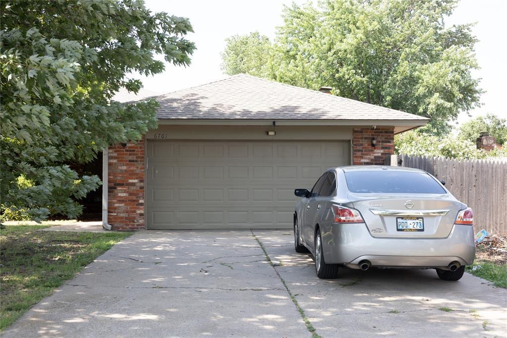 6701 W Britton St, Oklahoma City, OK 73132 - garage with concrete driveway