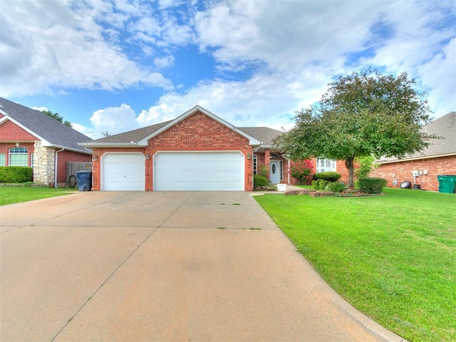 4821 SE 52nd St, Oklahoma City, OK 73135 - view of front of house with brick siding, driveway, a garage, and a front yard