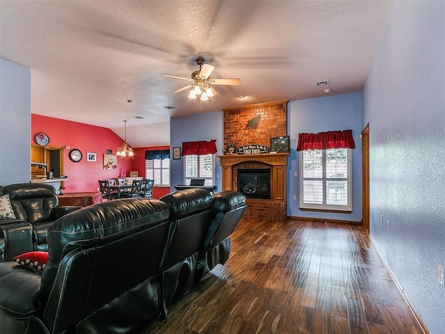 4821 SE 52nd St, Oklahoma City, OK 73135 - living area with plenty of natural light, ceiling fan, a brick fireplace, hardwood / wood-style floors, and vaulted ceiling