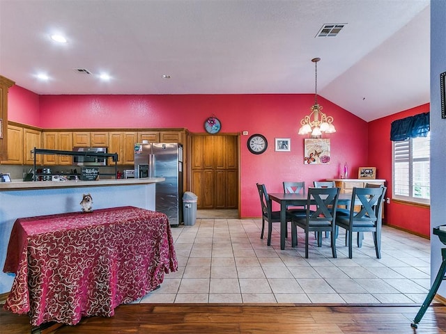 4821 SE 52nd St, Oklahoma City, OK 73135 - dining room featuring vaulted ceiling, a chandelier, light wood-type flooring, and recessed lighting
