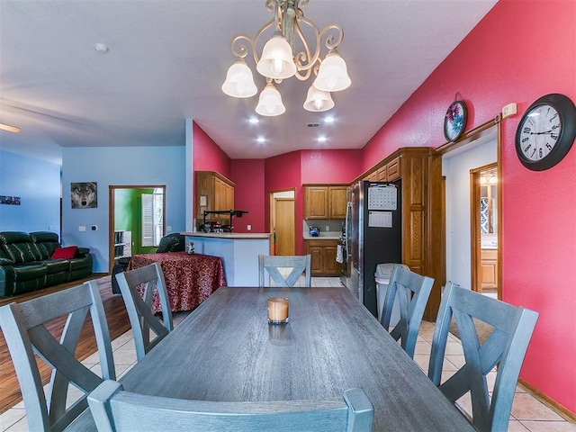 4821 SE 52nd St, Oklahoma City, OK 73135 - dining space featuring a chandelier and light tile patterned flooring
