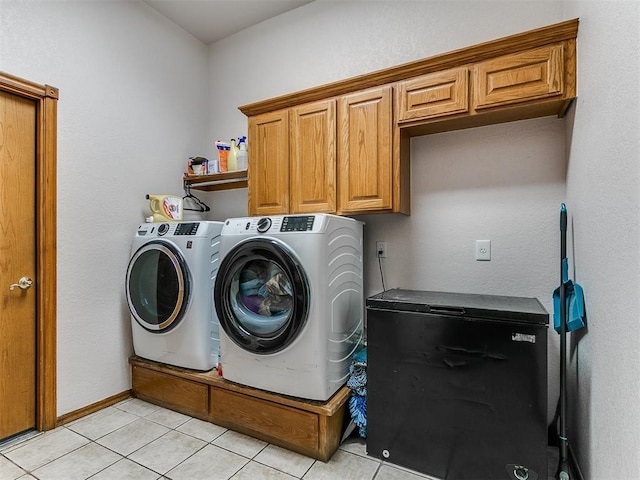 4821 SE 52nd St, Oklahoma City, OK 73135 - laundry room with washing machine and dryer, cabinet space, and light tile patterned floors