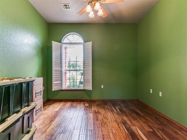 4821 SE 52nd St, Oklahoma City, OK 73135 - spare room with a ceiling fan, wood finished floors, and a textured wall