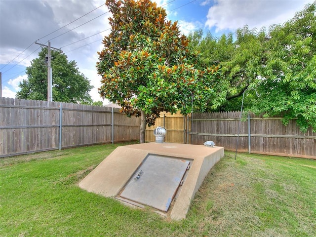 4821 SE 52nd St, Oklahoma City, OK 73135 - entry to storm shelter with a fenced backyard