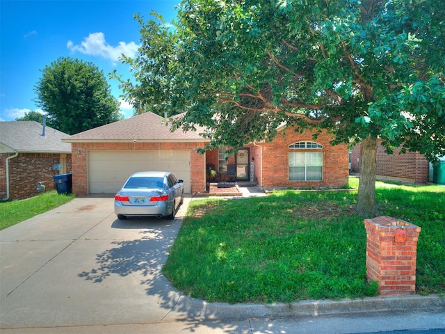 12320 NW 4th St, Yukon, OK 73099 - view of front facade featuring driveway, brick siding, an attached garage, and a front lawn
