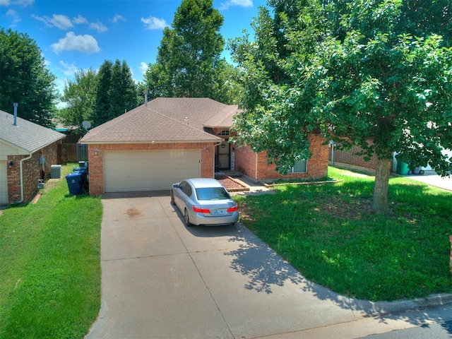 12320 NW 4th St, Yukon, OK 73099 - single story home with driveway, brick siding, an attached garage, and a front lawn