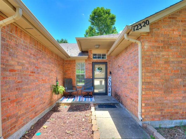 12320 NW 4th St, Yukon, OK 73099 - entrance to property with brick siding and roof with shingles