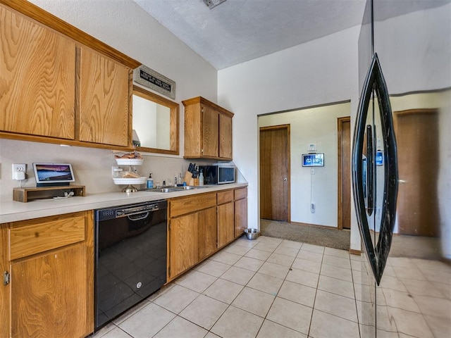 12320 NW 4th St, Yukon, OK 73099 - kitchen featuring black dishwasher, stainless steel microwave, light countertops, light tile patterned flooring, and brown cabinets
