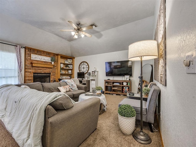 12320 NW 4th St, Yukon, OK 73099 - living area with carpet floors, a ceiling fan, and a brick fireplace