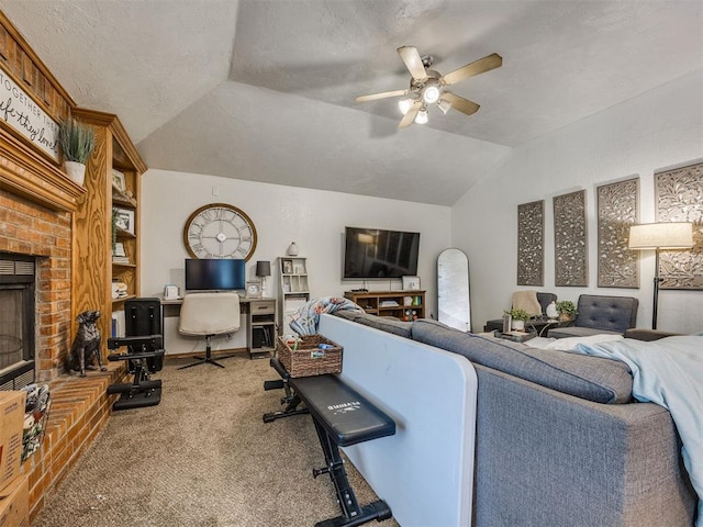 12320 NW 4th St, Yukon, OK 73099 - carpeted living area with vaulted ceiling, a ceiling fan, a brick fireplace, and a textured ceiling