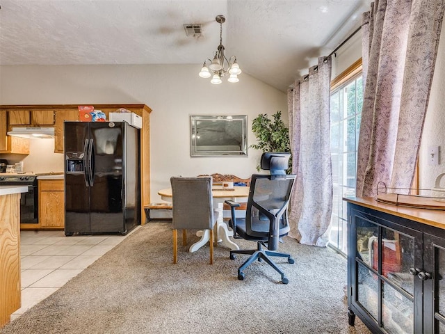 12320 NW 4th St, Yukon, OK 73099 - dining room with vaulted ceiling, light tile patterned floors, and a chandelier