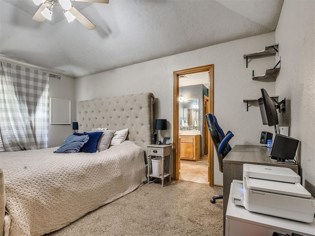 12320 NW 4th St, Yukon, OK 73099 - bedroom with an office area, light carpet, a textured wall, ensuite bath, and a ceiling fan