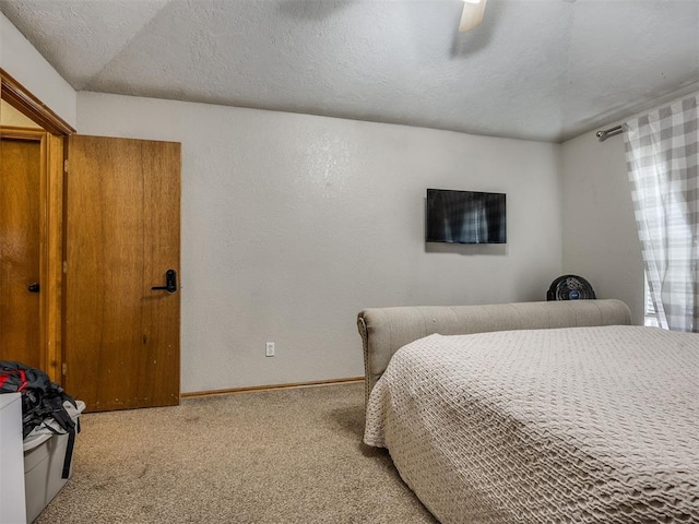 12320 NW 4th St, Yukon, OK 73099 - carpeted bedroom featuring a ceiling fan and a textured wall