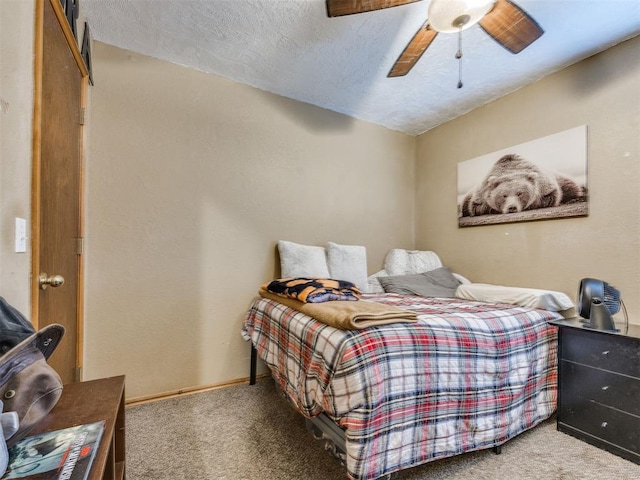 12320 NW 4th St, Yukon, OK 73099 - carpeted bedroom with a textured ceiling and a ceiling fan