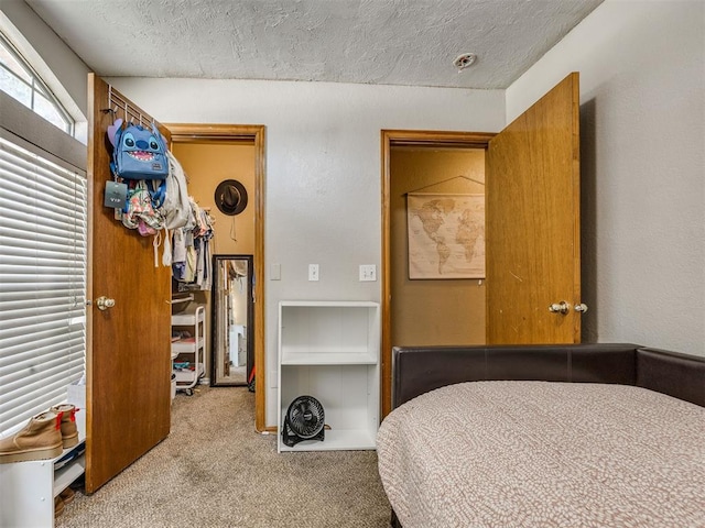 12320 NW 4th St, Yukon, OK 73099 - carpeted bedroom with a textured ceiling
