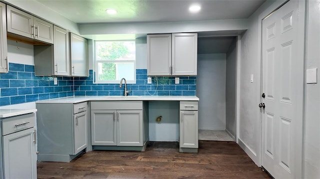 5717 S Francis Ave, Oklahoma City, OK 73109 - kitchen with gray cabinetry, dark wood-type flooring, backsplash, recessed lighting, and light countertops