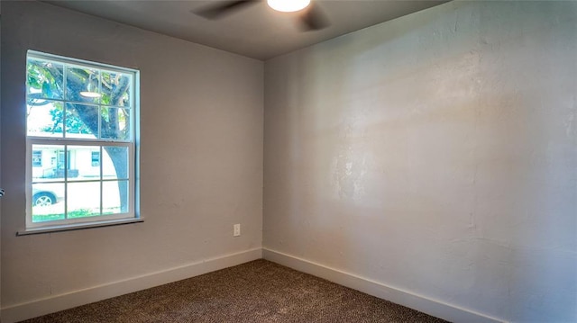 5717 S Francis Ave, Oklahoma City, OK 73109 - spare room featuring healthy amount of natural light, a ceiling fan, and dark colored carpet