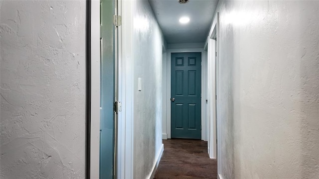 5717 S Francis Ave, Oklahoma City, OK 73109 - corridor with dark wood-type flooring and a textured wall