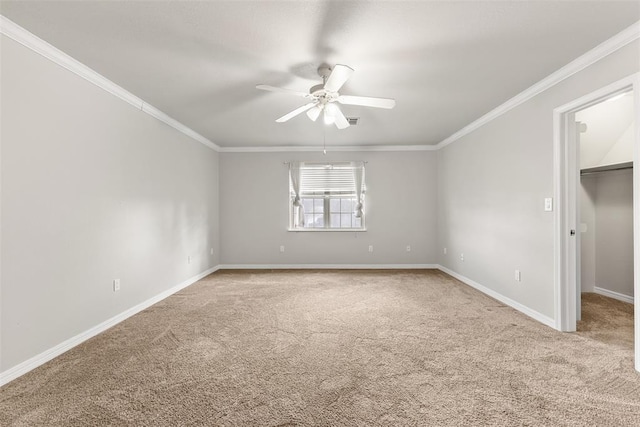 1505 S Augusta Dr, Ada, OK 74820 - unfurnished bedroom with carpet, crown molding, a walk in closet, and a ceiling fan