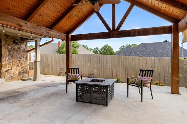 1505 S Augusta Dr, Ada, OK 74820 - fenced backyard with an outdoor fire pit, a ceiling fan, and a patio area