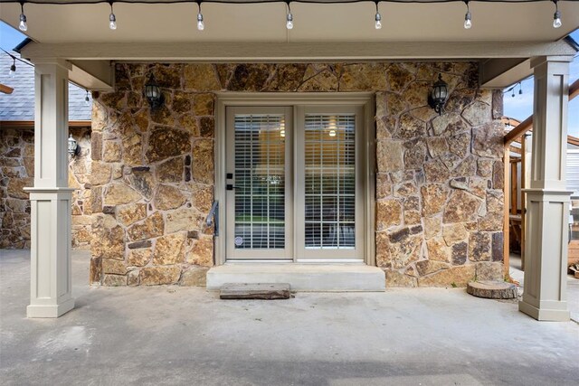 1505 S Augusta Dr, Ada, OK 74820 - view of exterior entry featuring stone siding