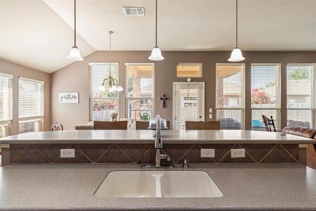 2308 SW 135th St, Oklahoma City, OK 73170 - kitchen with hanging light fixtures, lofted ceiling, and a chandelier