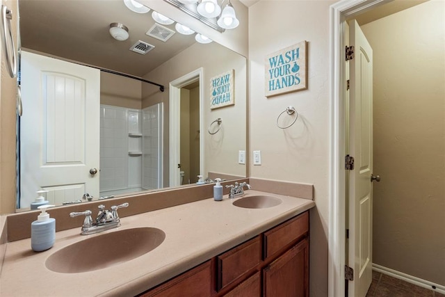 2308 SW 135th St, Oklahoma City, OK 73170 - bathroom featuring double vanity, tub / shower combination, and tile patterned floors