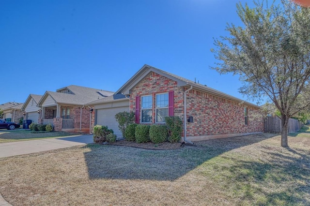 9544 SW 27th St, Oklahoma City, OK 73128 - ranch-style house featuring brick siding, a garage, and driveway
