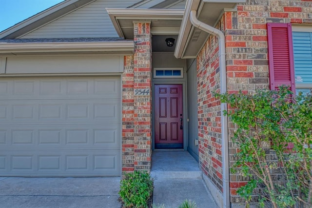 9544 SW 27th St, Oklahoma City, OK 73128 - property entrance featuring brick siding and an attached garage