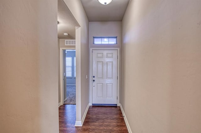 9544 SW 27th St, Oklahoma City, OK 73128 - doorway featuring dark wood-style flooring and baseboards