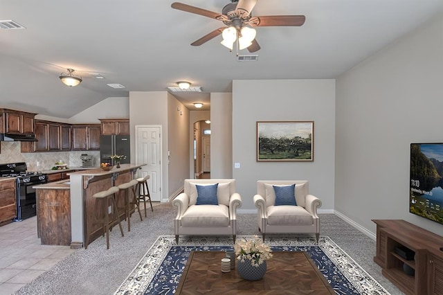 9544 SW 27th St, Oklahoma City, OK 73128 - living area featuring a ceiling fan and vaulted ceiling