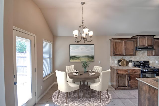 9544 SW 27th St, Oklahoma City, OK 73128 - dining room featuring a chandelier, light tile patterned floors, and vaulted ceiling