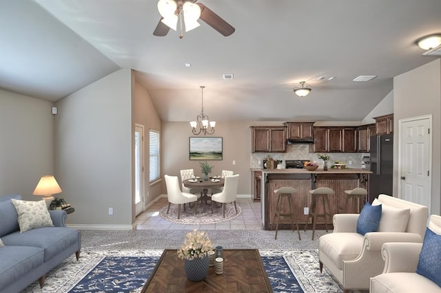 9544 SW 27th St, Oklahoma City, OK 73128 - living area with vaulted ceiling, a ceiling fan, and a chandelier